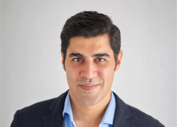 Head shot of Dr. Parag Khanna, founder and CEO of Climate Alpha, pictured against a white background