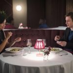Two "Black Mirror" characters on a dinner date